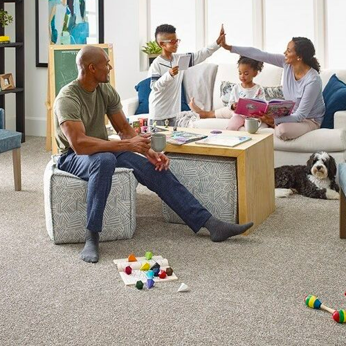 Family playing in living room | Carpet Empire Plus